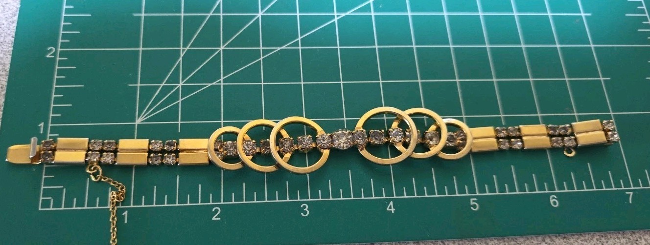 Goldtone Circles with Rhinestone Bracelet With Safety Chain Box Clasp. #781