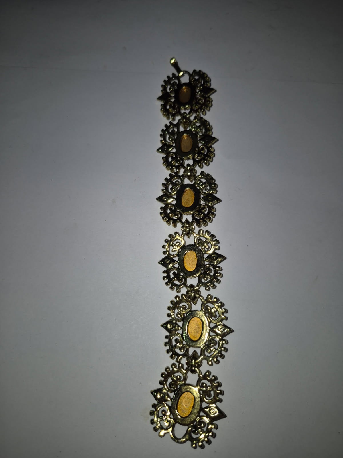 Vintage ornate gold tone panel link red glass cabochon bracelet, unsigned TT8