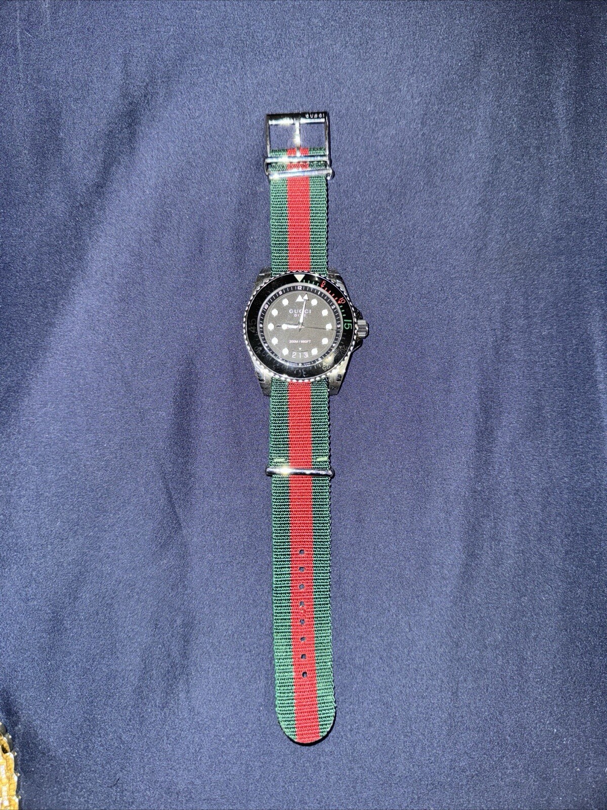 100% Authentic ￼Gucci Dive Black Men’s Watch with green/red strap.