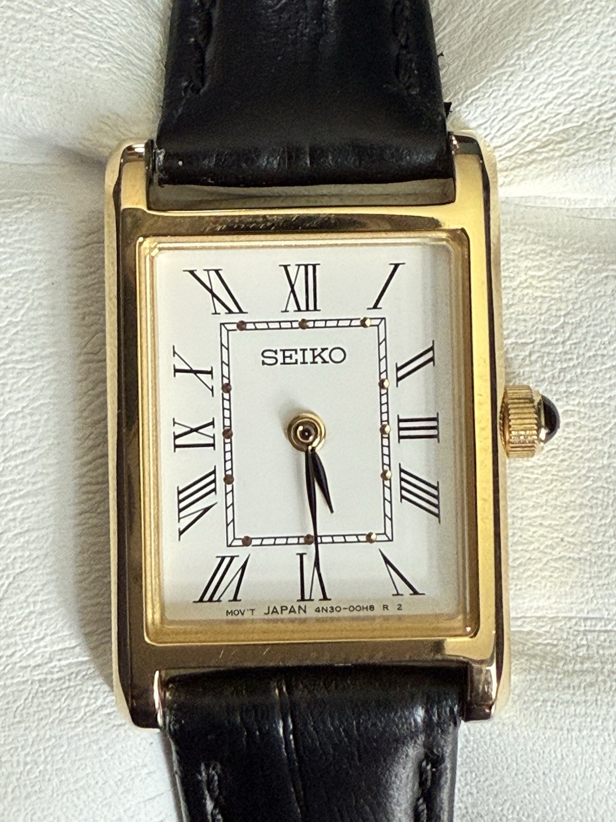 Vintage Seiko Women’s Quartz Tank Gold Tone White Roman Dial Black Leather Strap