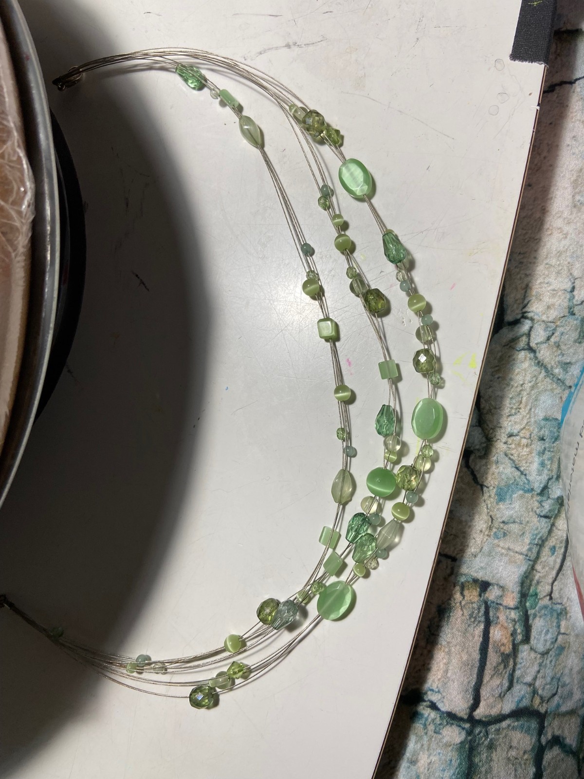 Invisibly strung light medium green color stones 3 Strands