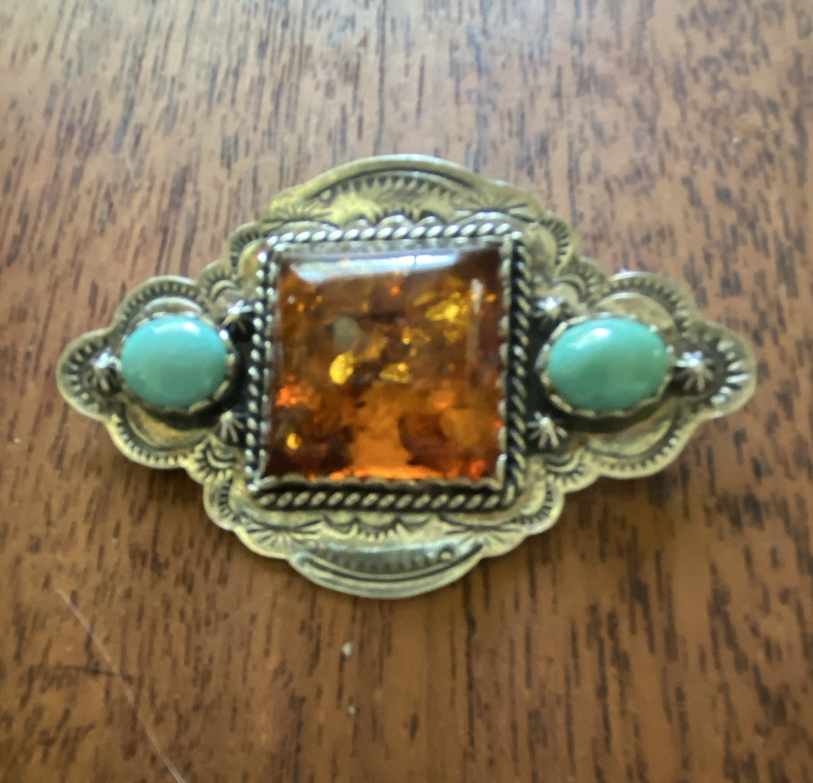 Sterling brooch, Amber Centerstone with turquoise side stones signed it is 2 1/2