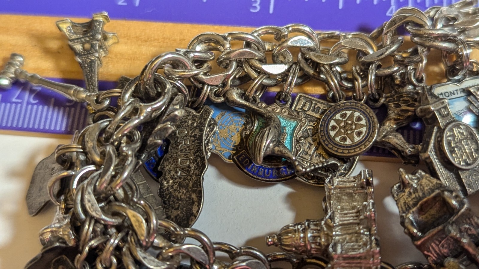 VINTAGE STERLING SILVER CHARM BRACELET WITH ABOUT 35 CHARMS WEIGHS 94.4 GRAMS