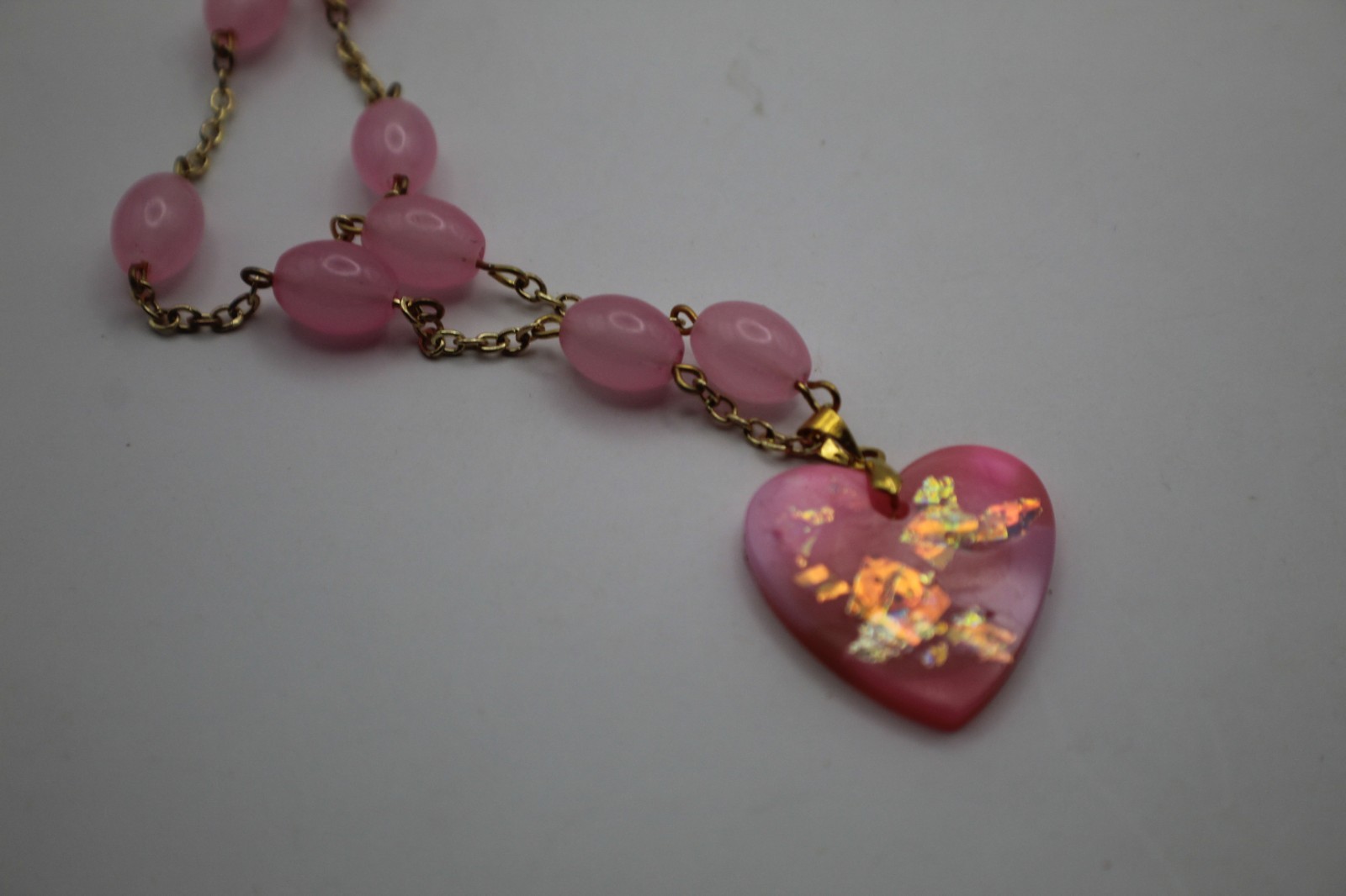 50 Shades Of Pink Heart Shaped Resin Pendant On A Beaded Chain