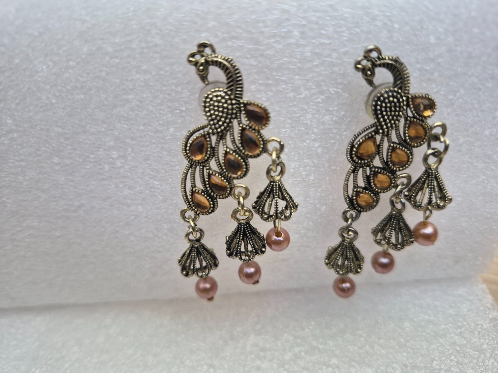 Peacock design Jhumka earrings for women with pearls and stone