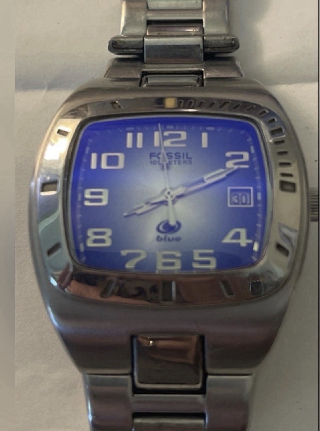 Vintage Fossil Blue stainless steel watch with Blue-to-Yellow Gradient Dial.
