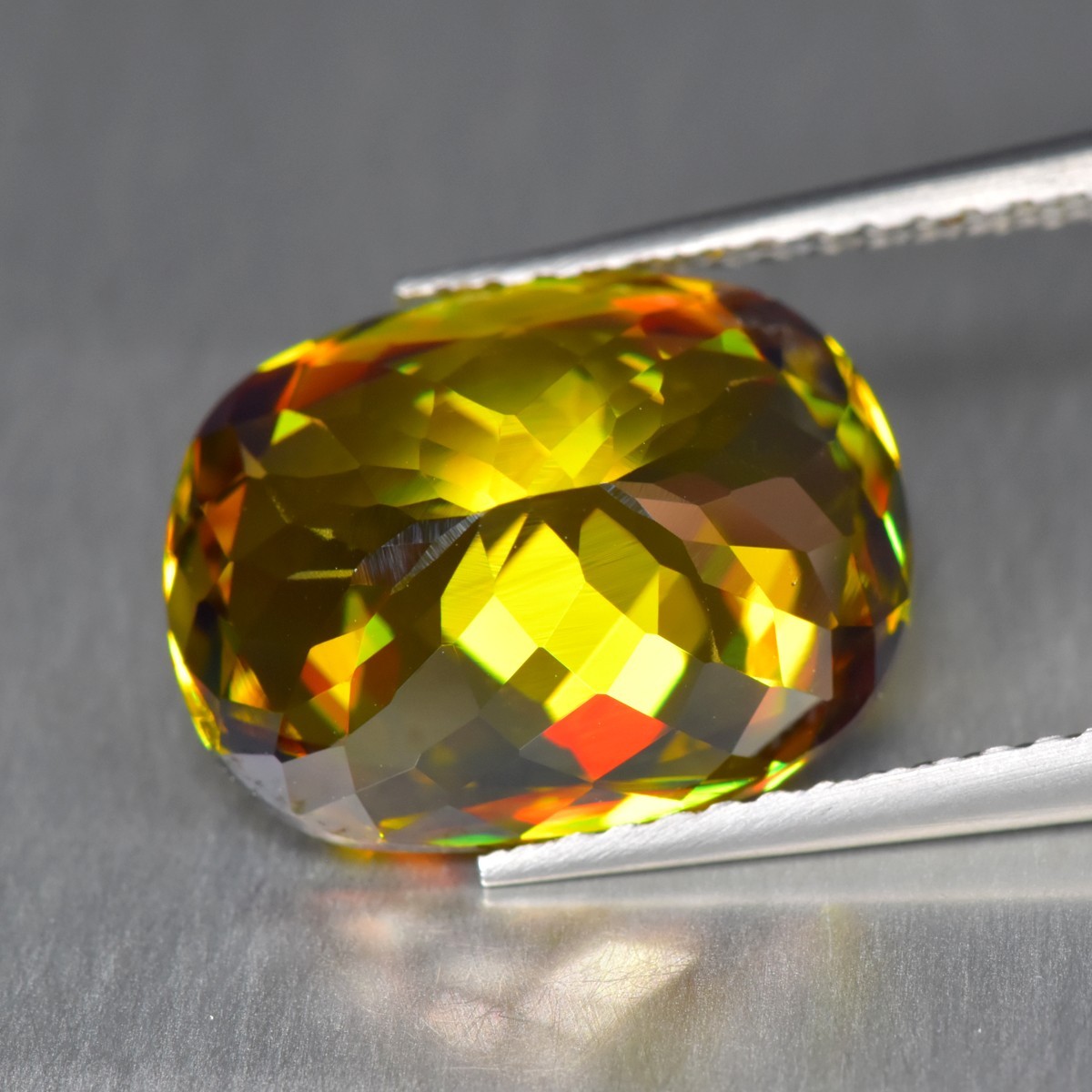 5.69Ct Oval Cut_Fair 100% Natural Multi color With Red Flash Titanite Sphene