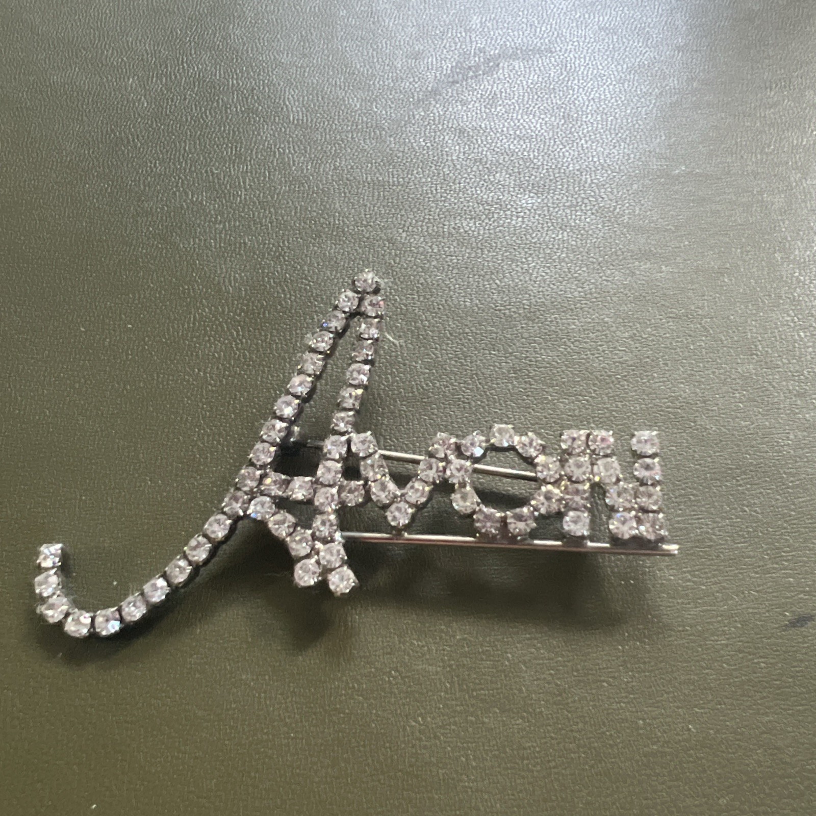 Beautiful Avon Silvertone Logo Pin (letters in Cursive) Approx. 1.75 X 2.5