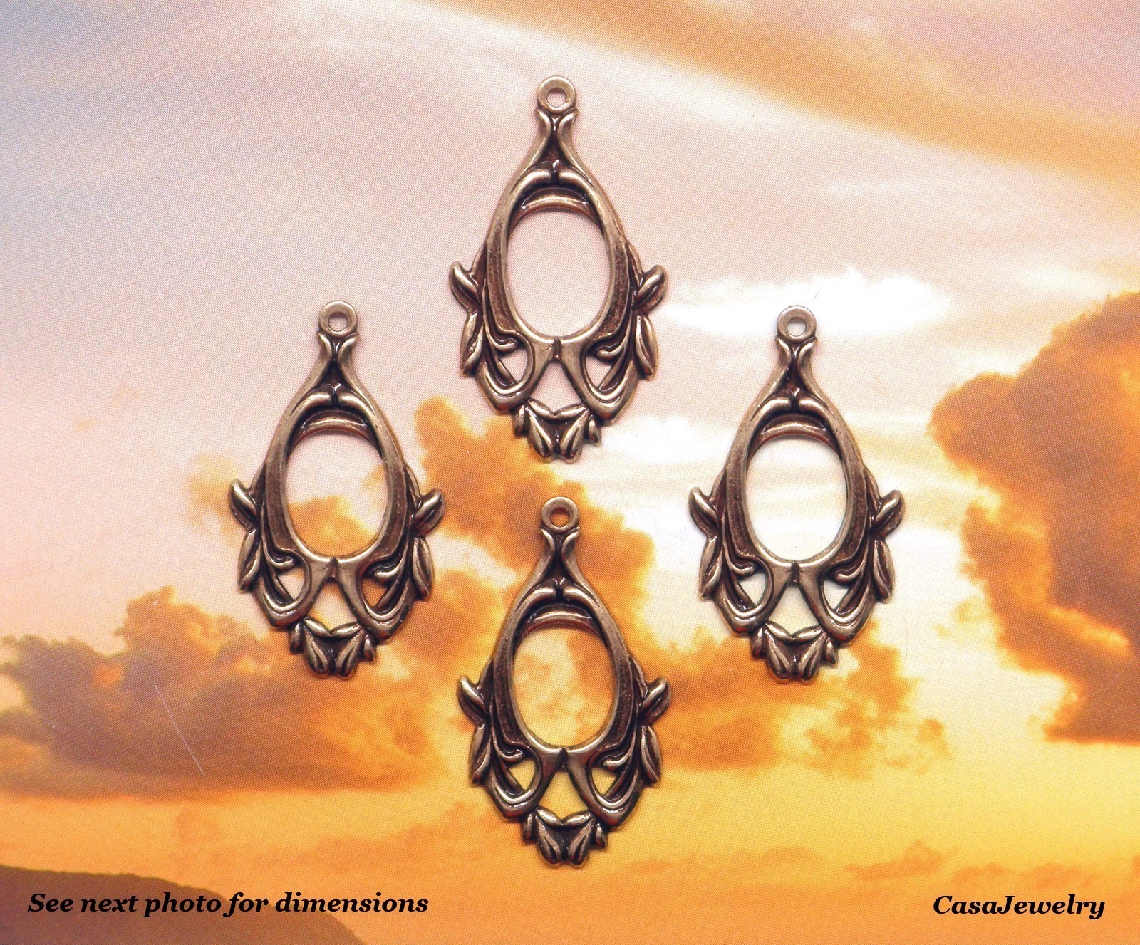 #0291 ANTIQUED GOLD OPEN CENTER DROP W/TOP HANG RING
