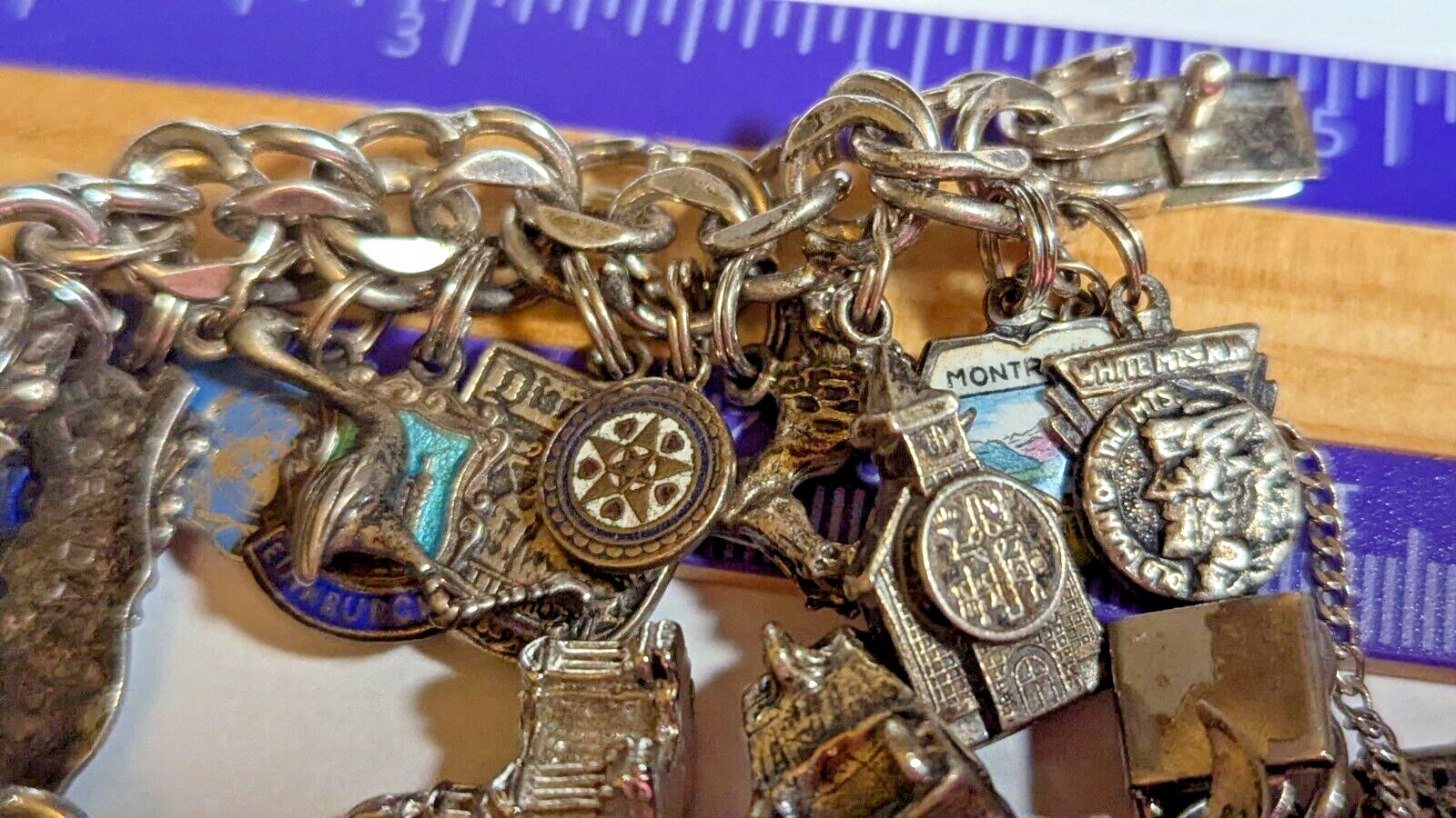VINTAGE STERLING SILVER CHARM BRACELET WITH ABOUT 35 CHARMS WEIGHS 94.4 GRAMS