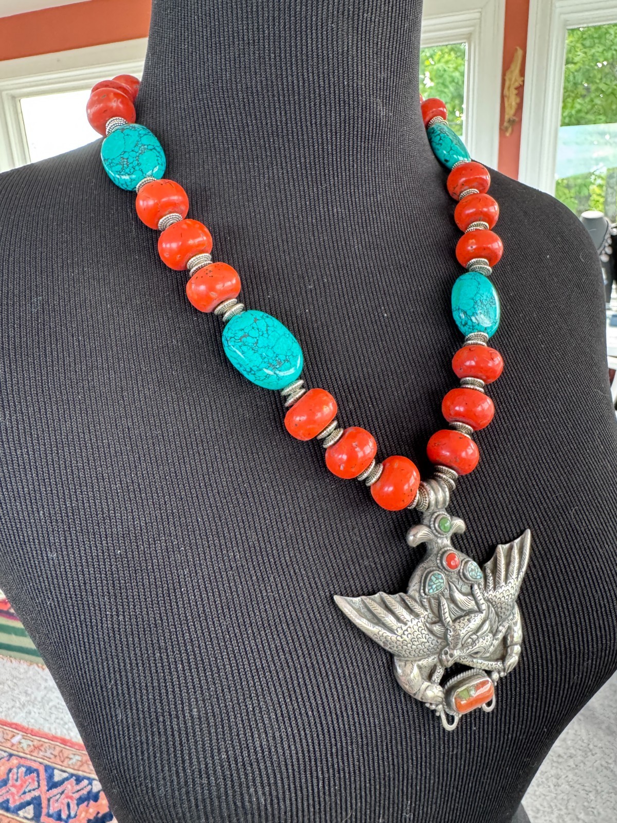 Silver Garuda pendant strung with natural coral and turquoise