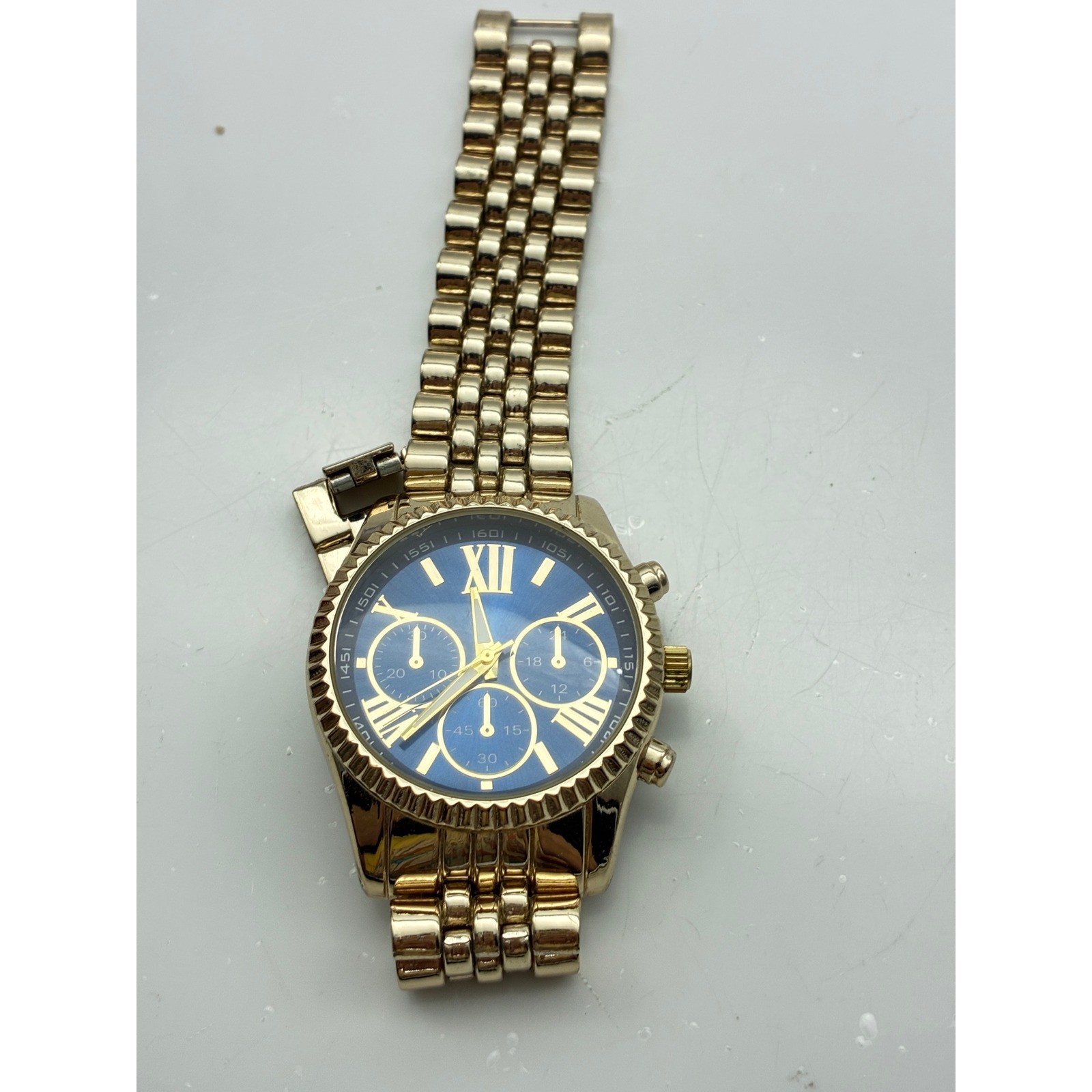 Accutime Watch Corp Gold Tone Blue Dial Chronograph Style Watch WM043115 PC21J