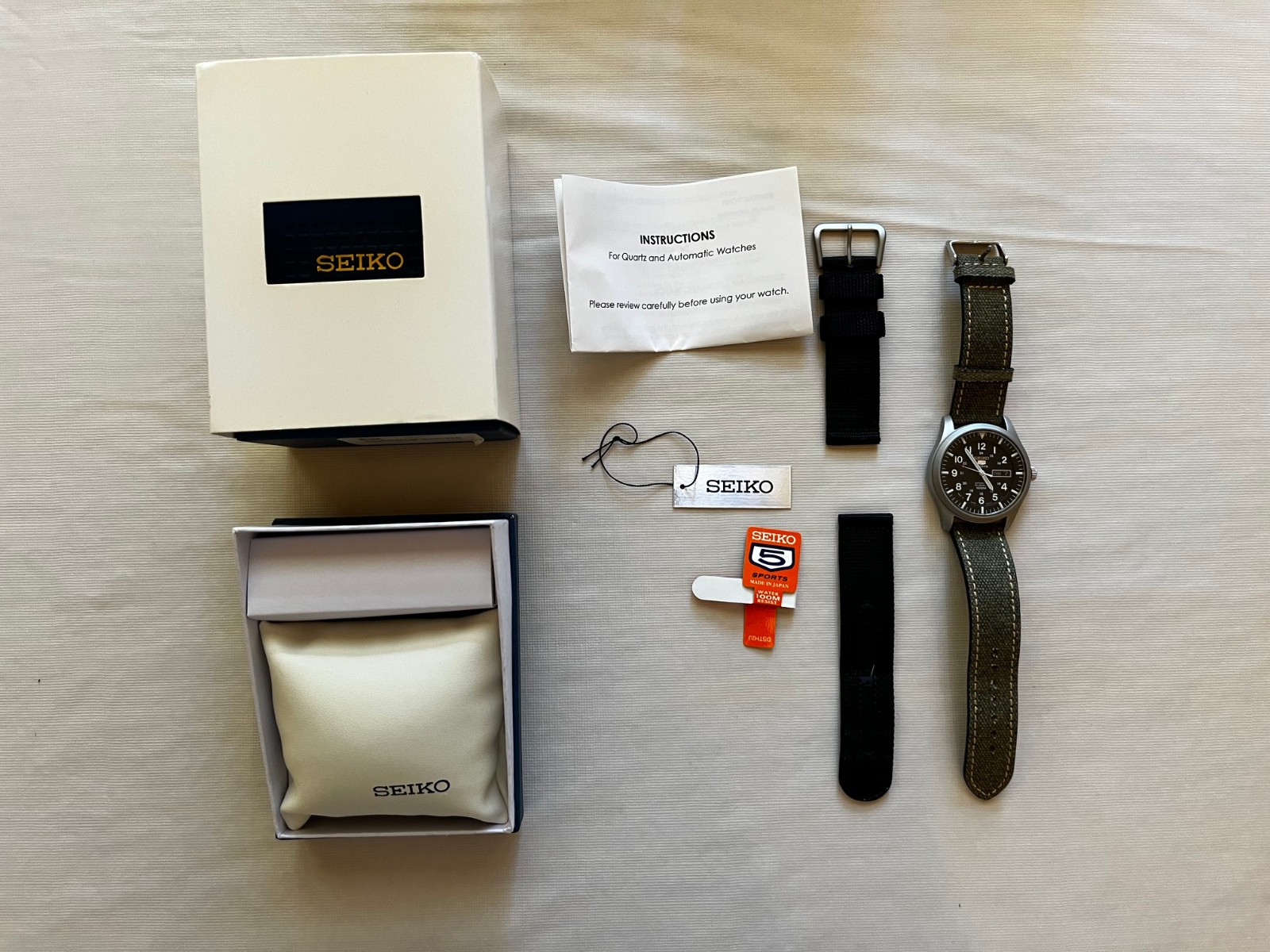 Seiko 5 Sports Men’s Black Watch – SNZG15 J1 – Japan – Extra Strap