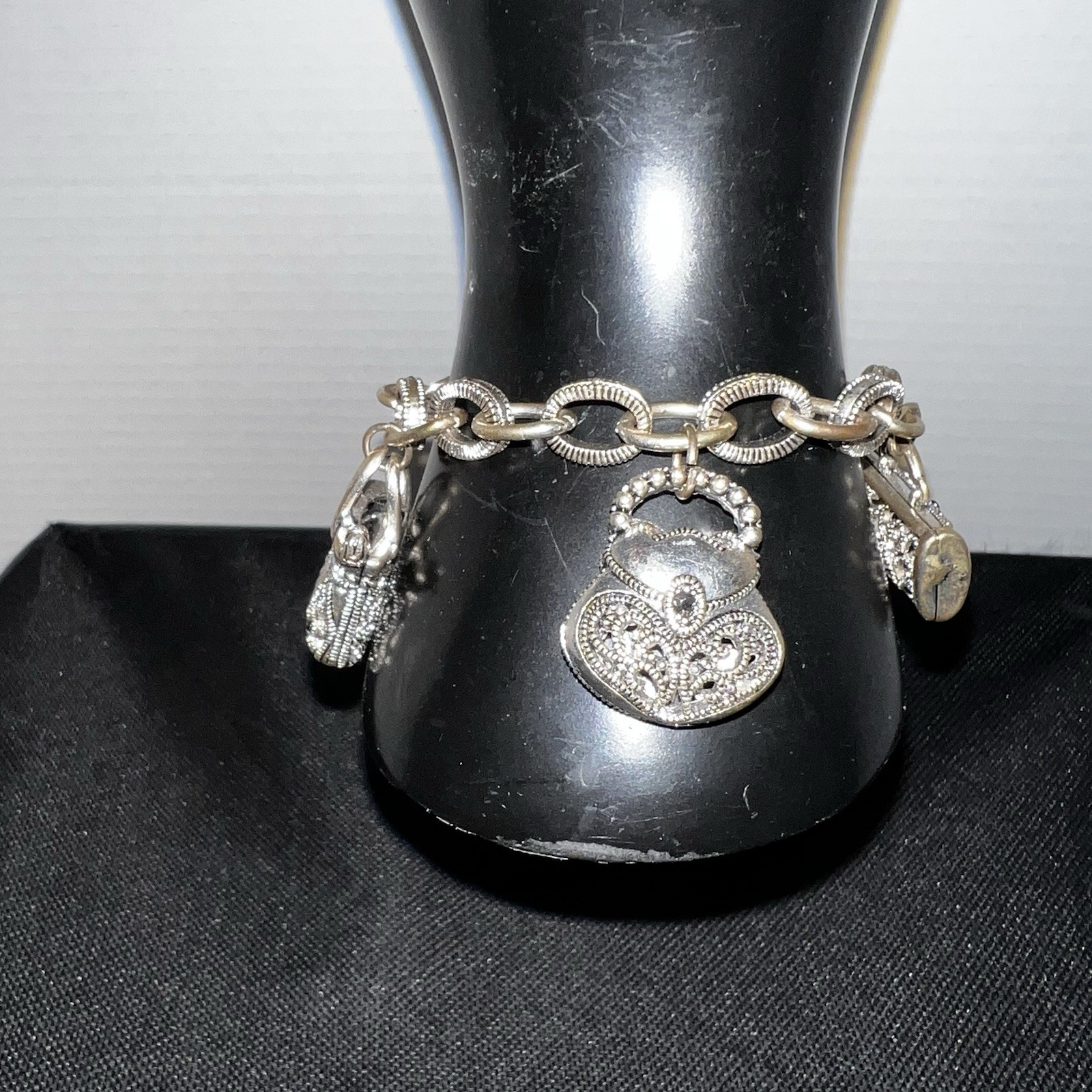 Silver-Tone Metal Puffy Openwork Purse Rhinestone Accent Charm Bracelet toggle