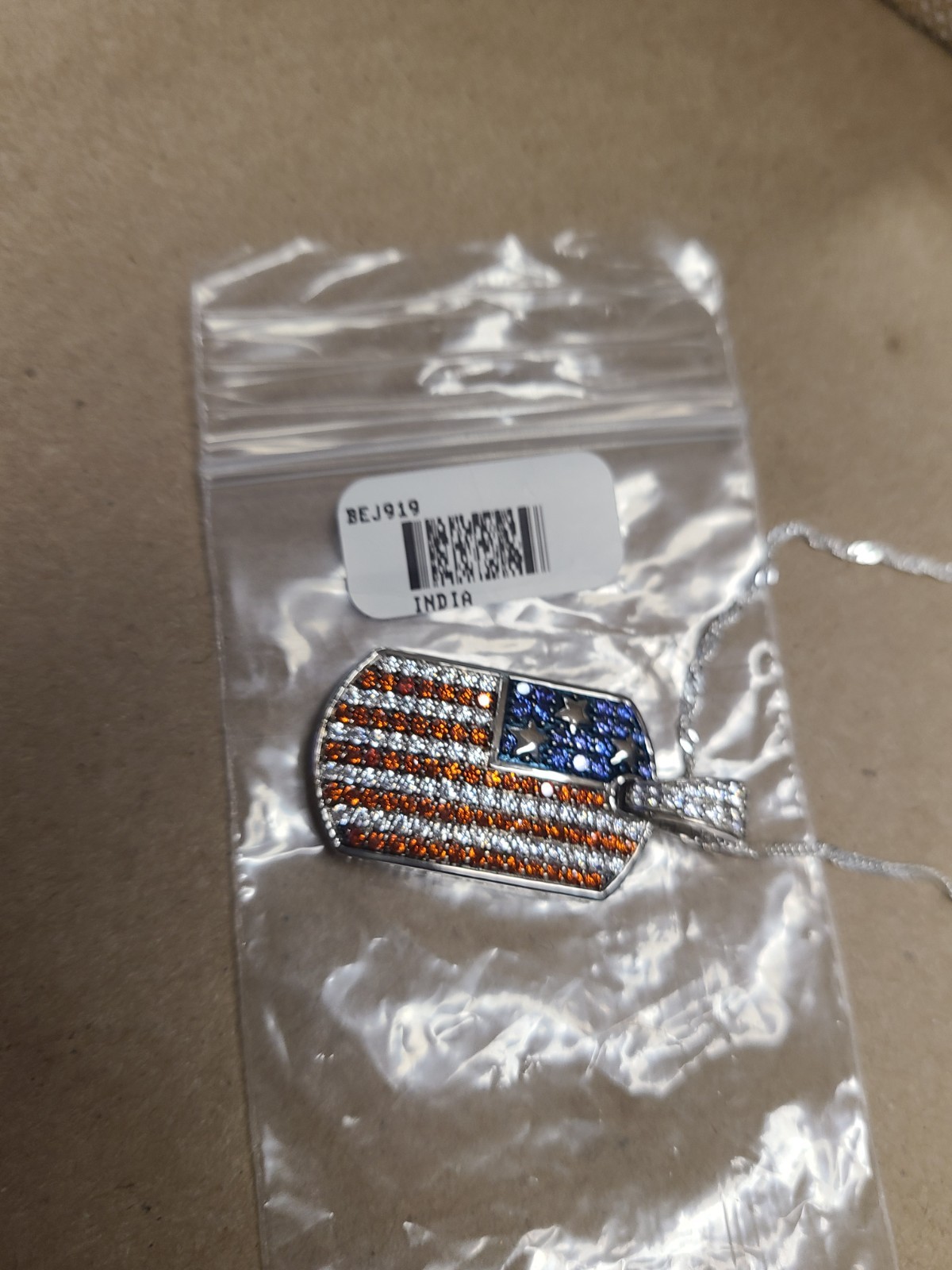 Garnet, White, And Blue Cubic Zirconia Rhodium Plated Ottone Flag Enhancer Penda