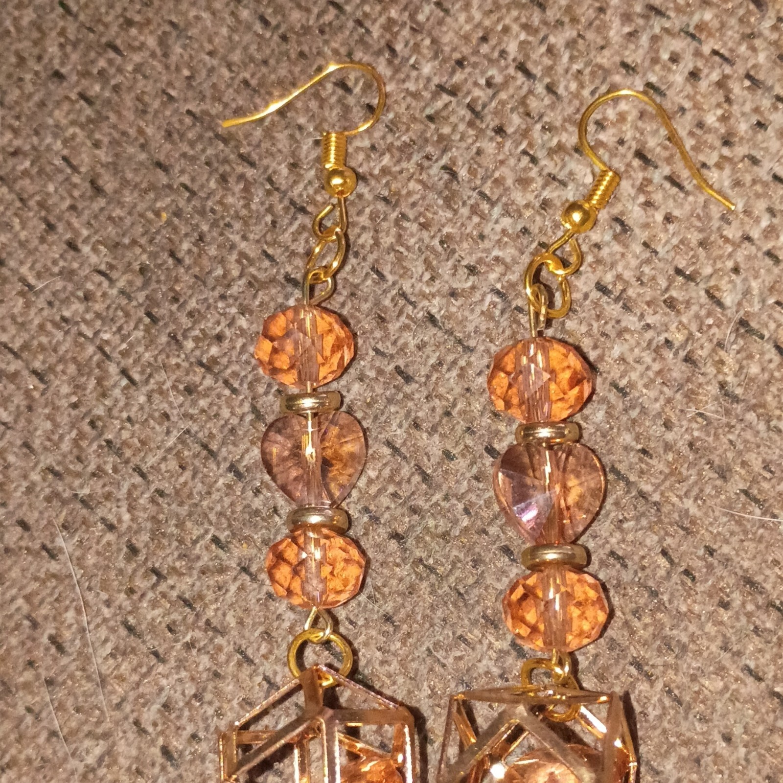 Handmade Beaded Earrings That Are Gold And Pink And Dangly