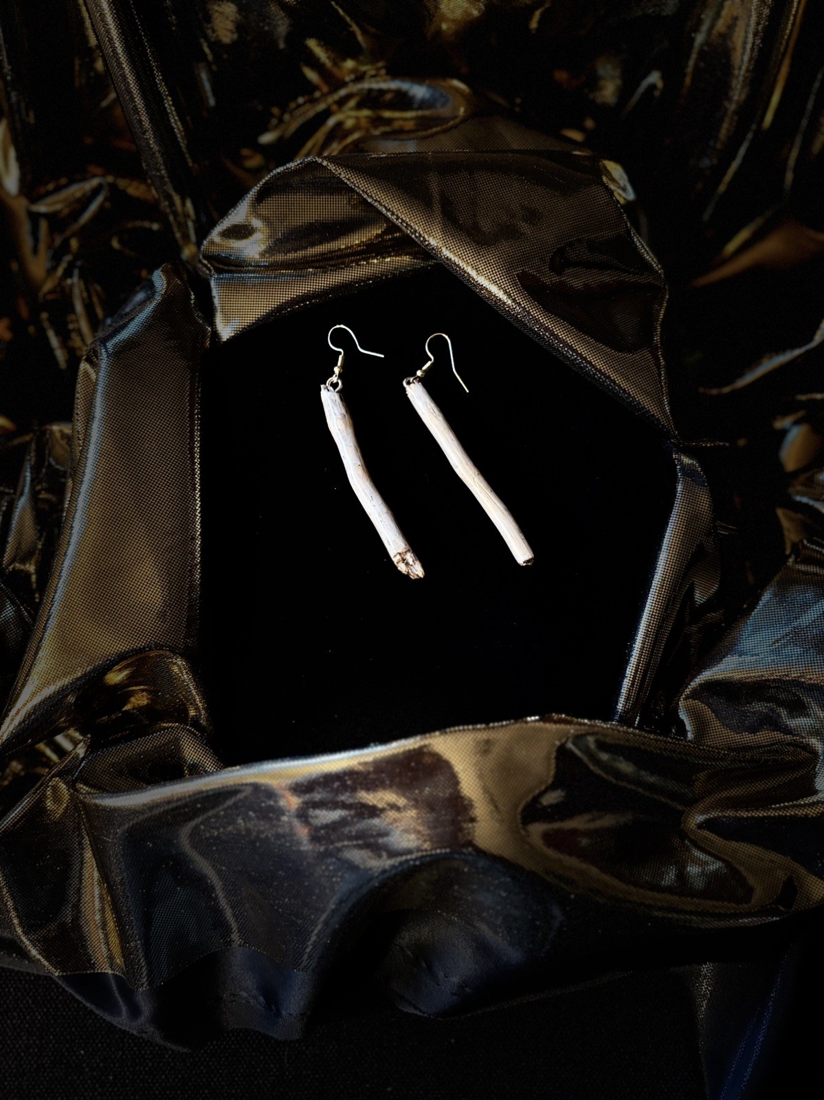 One of a kind jewelry made from real pieces of wood coated in resin