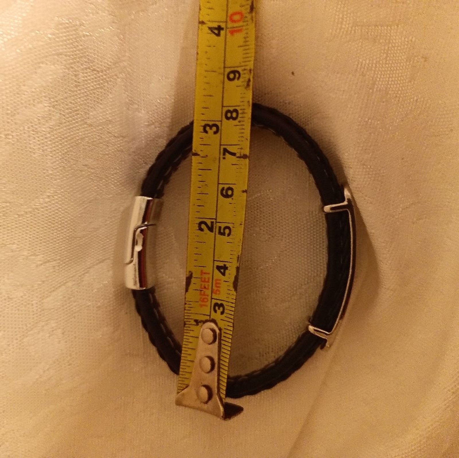 Guess Black leather twine and silver tone women’s bracelet