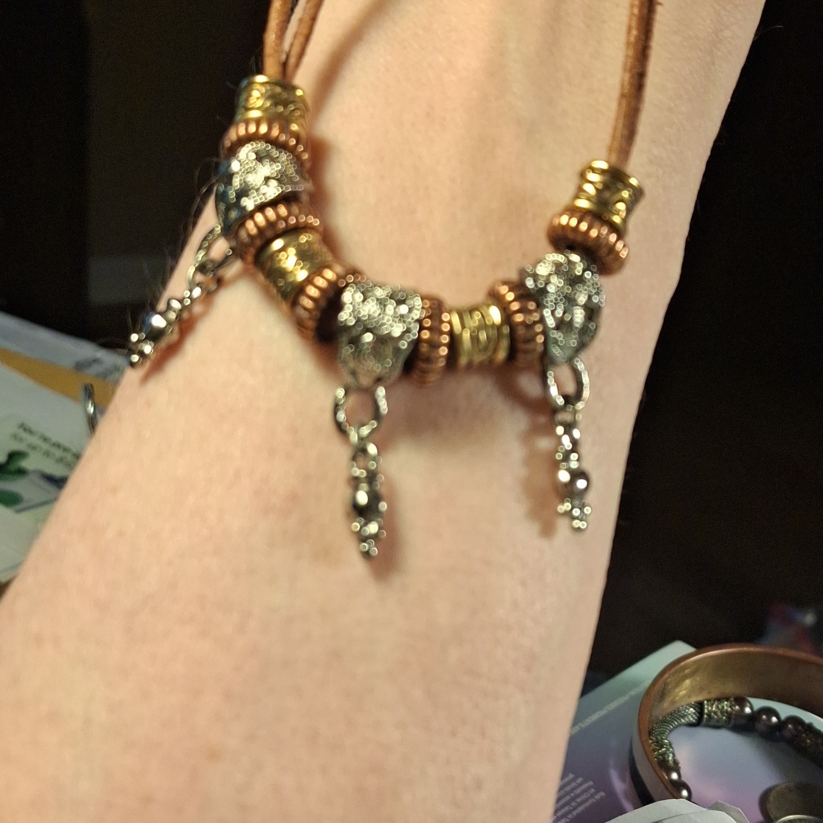 Robert Rose signed pre-owned necklace with brown cord & 3 tone ornate beads