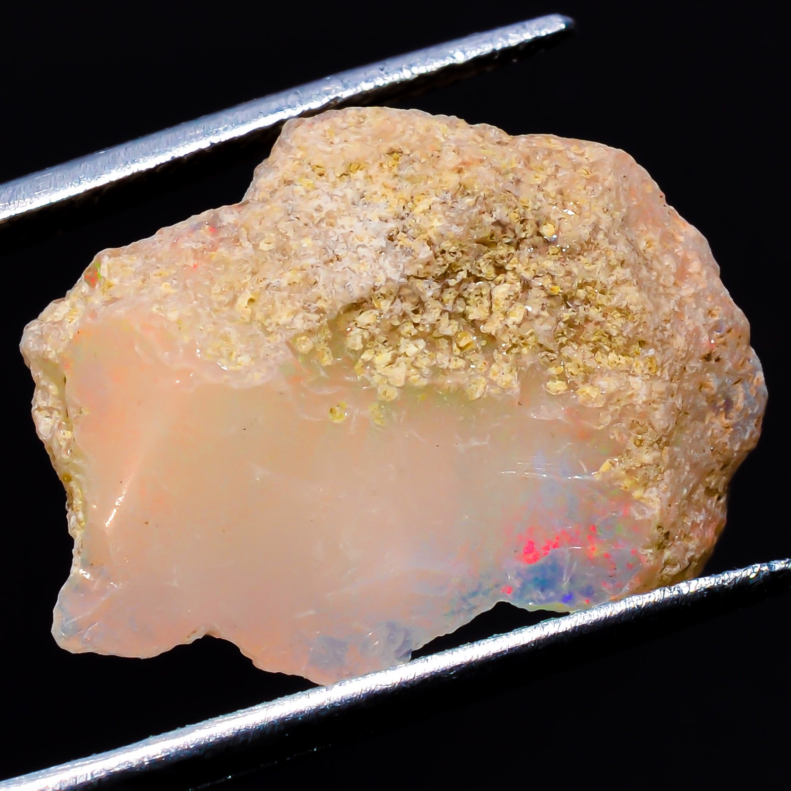 Natural play of color Ethiopian Opal rough gemstone 9.05 Carat. (16 x 21 x 6 mm)