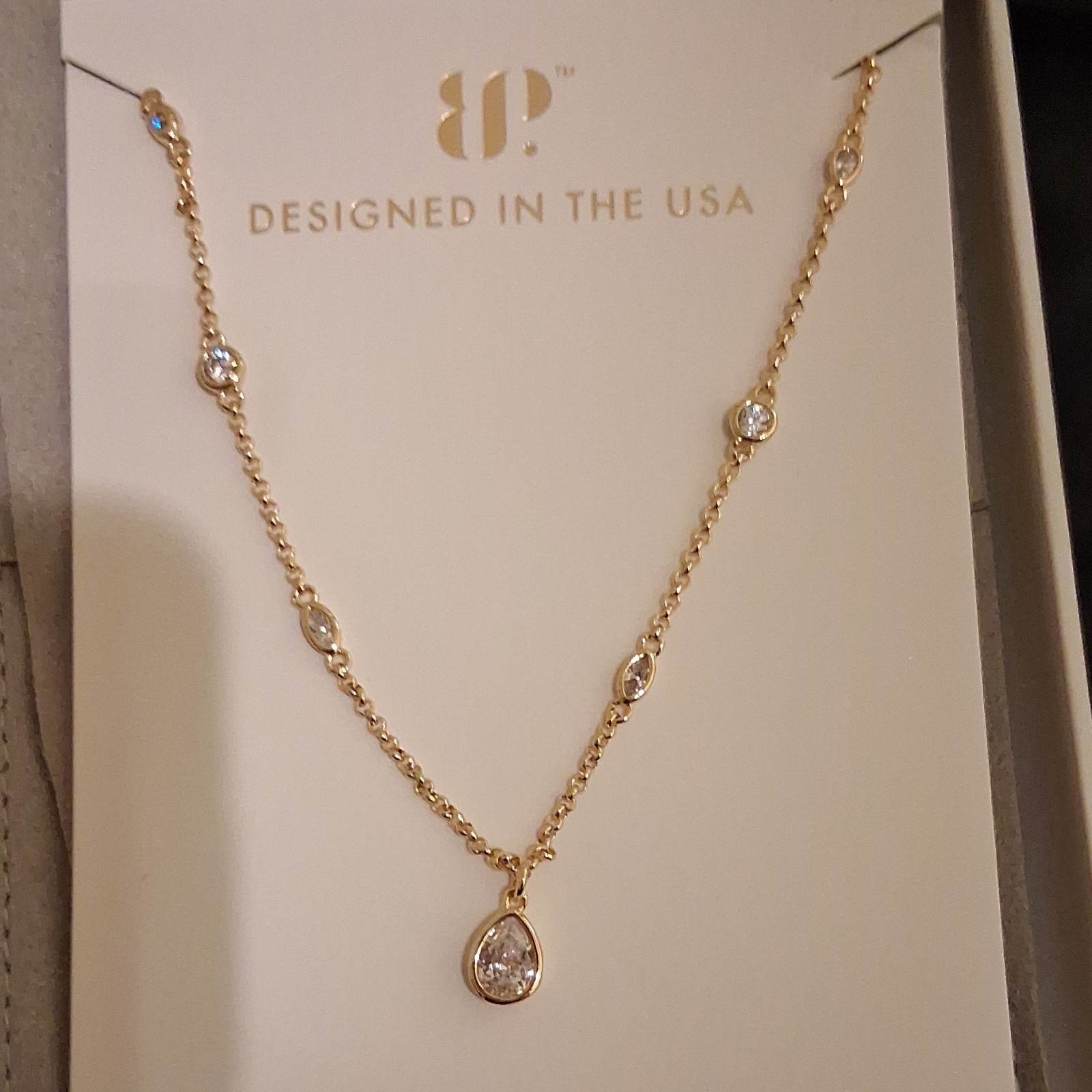 IDUNNA Gold Plated White CZ Teardrop Bezel Pendant Cable Necklace 18″ Adj