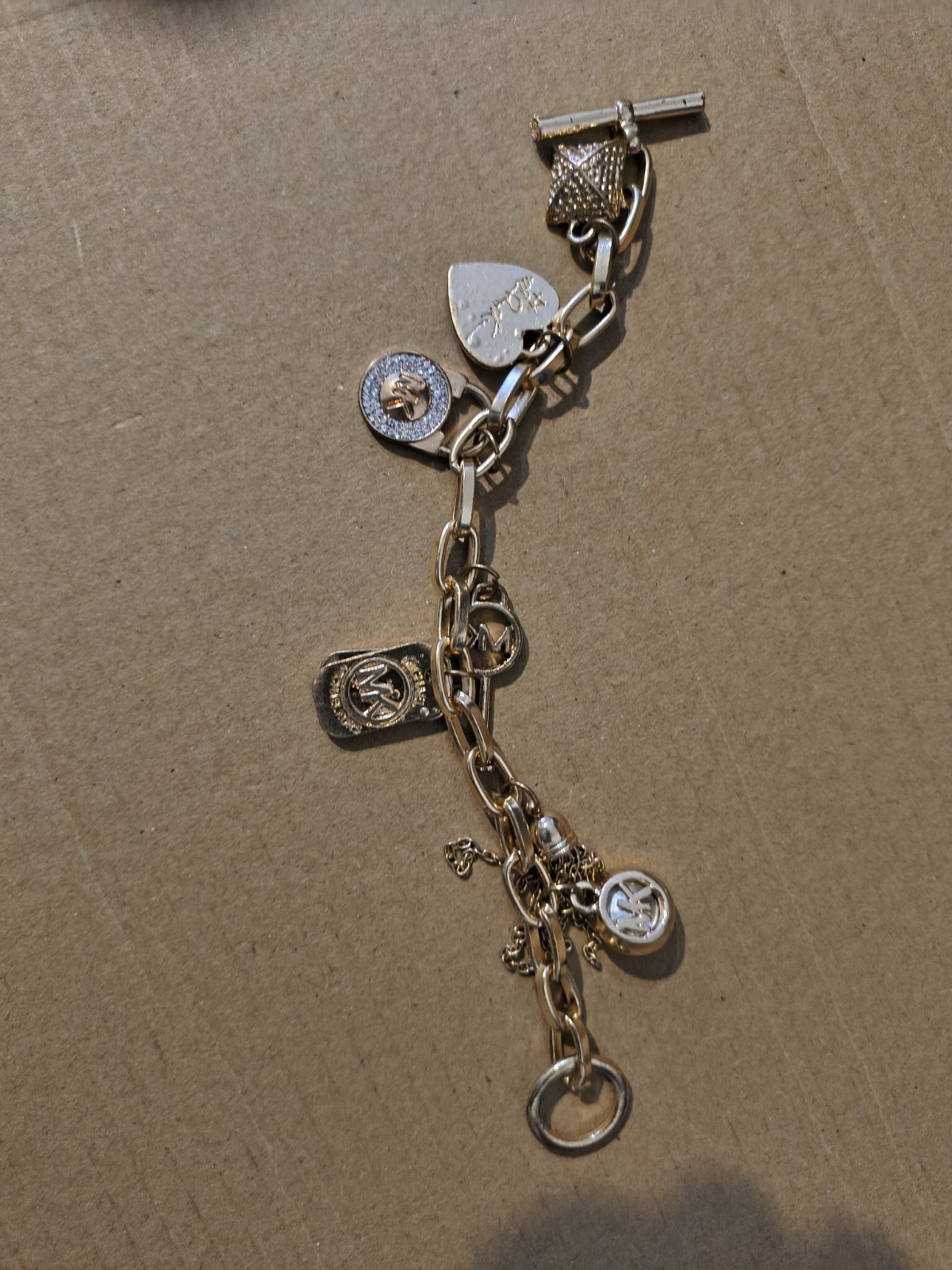 Michael Kors Gold Tone Toggle Oval Link Chain Bracelet Crystal Pavé Charm