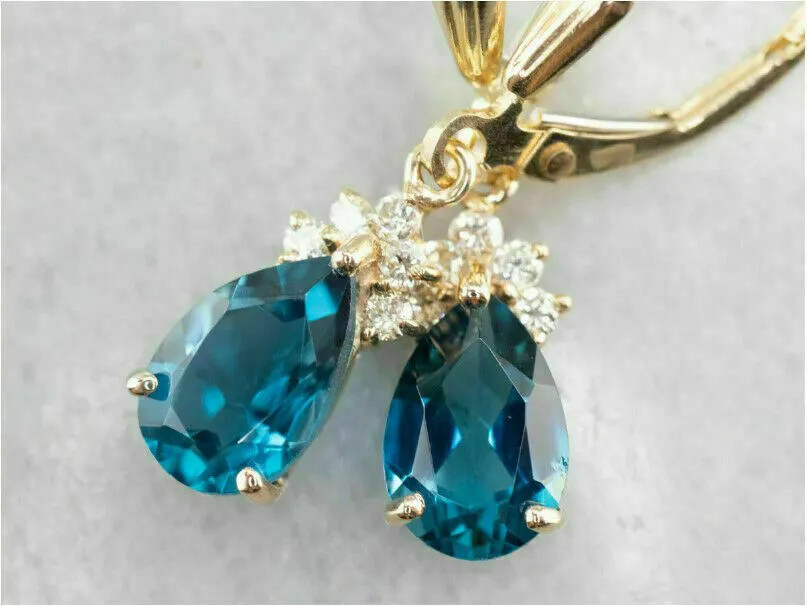 Sterling Silver Blue Teardrop Gemstone Dangle Earrings in Gold Finish
