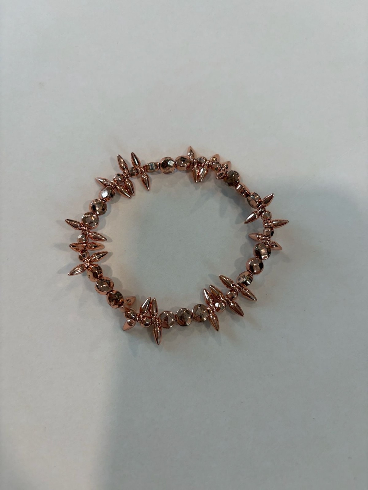 Set of 5 Rose Gold Tone Fashion Bracelets, a Ring and a Charm