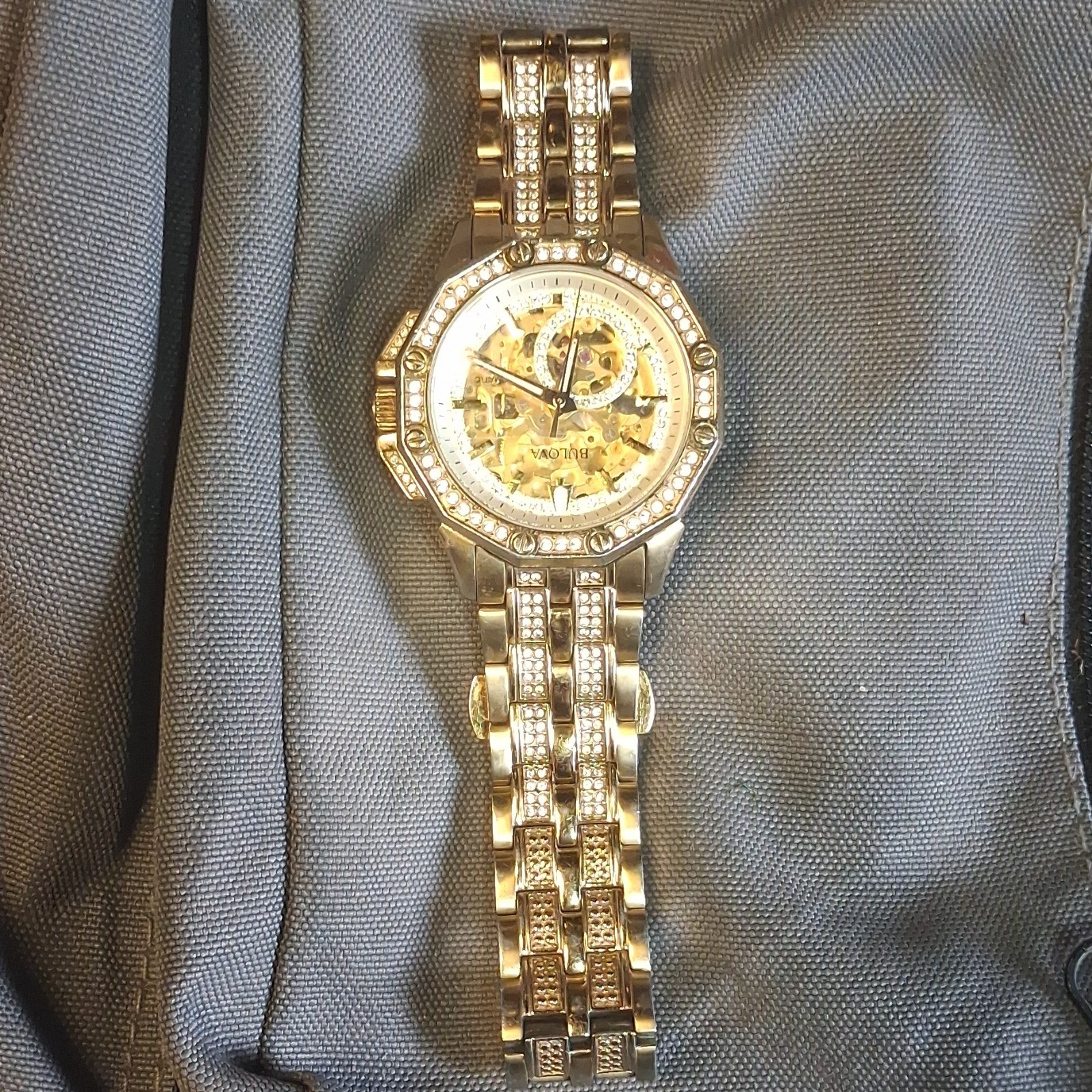 Bulova Mens Automatic Skeleton Dial Gold-Tone Bracelet Watch Crystal Bezel