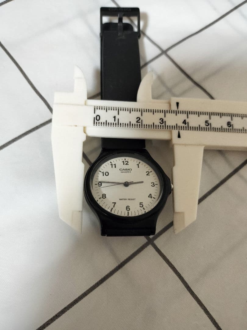 Excellent condition, fully functional CASIO MQ-24 analog black wristwatch.