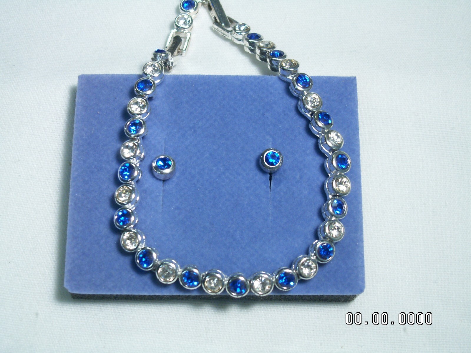 2002 AVON…Silver Tone,Sapphire Blue Crystals Bracelet & Pierced Earrings Set