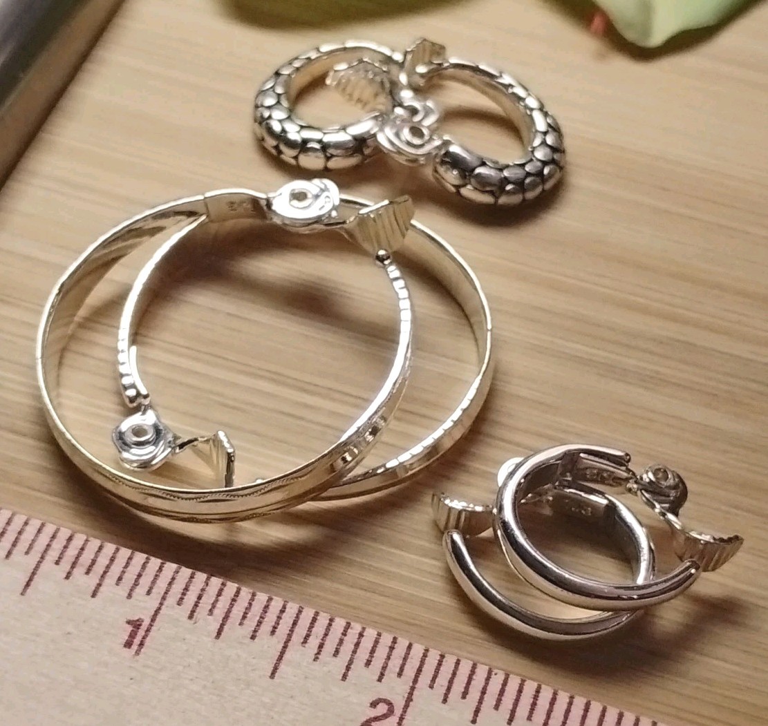 The JEWELRY GROUP TJG Set of THREE (3) Silver Toned Hoop Clip On Earrings!