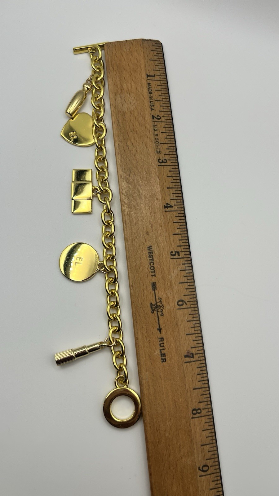 Vintage ESTEE LAUDER Runway Gold Tone Charm Bracelet Couture 7.5 ”