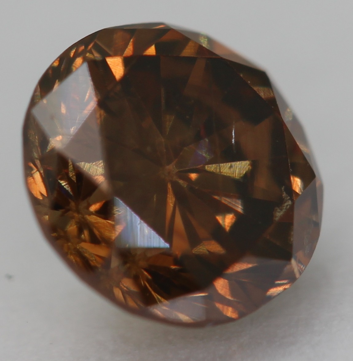 0.63 Ct Orangy Brown VVS2 Round Brilliant Natural Enhanced Diamond 5.38mm VIDEO