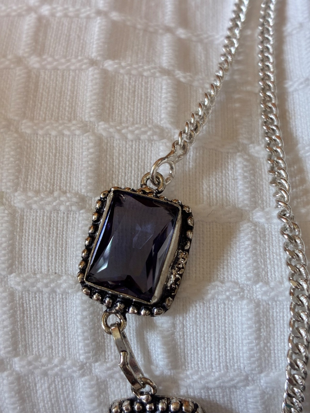 Dramatic large purple glass stones set in silver neckla