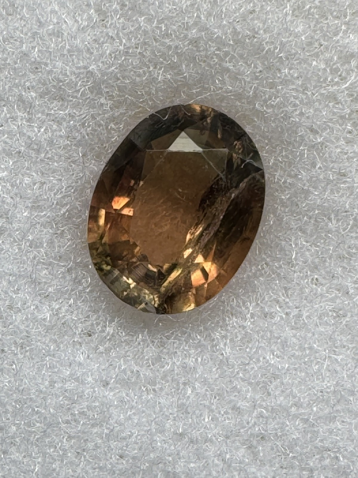 TOURMALINE. Cognac Oval, Very Slight Inclusion. 7.9 X 6.1 mm, 1.27 Carats.